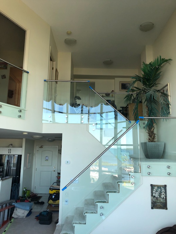 Custom frameless glass staircase railing fabricated by Barrie Glass & Mirror